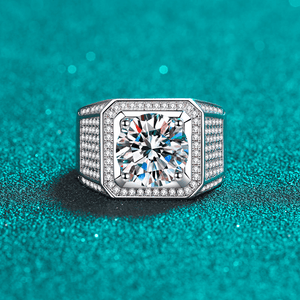 Diamond ring with a teal background