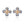 Pair of earrings with gold star-shaped centers and clear gemstones on a white background