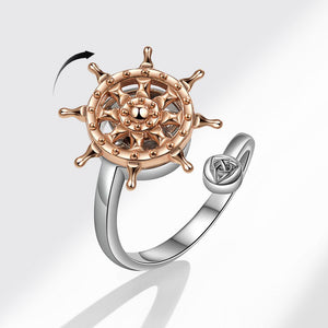Rose gold and silver steering wheel ring on a white background