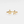 Gold ring with sea turtle and starfish design on a white background