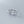 Silver turtle-shaped rings on a gray background.