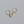 Gold hoop earrings with shell-shaped charms on a gray background