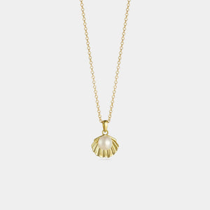 Gold necklace with a pearl pendant on a light gray background