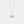 Silver necklace with a shell and pearl pendant on a light gray background
