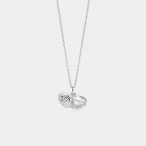 Silver necklace with a shell and pearl pendant on a light gray background