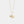 Gold necklace with a heart and pearl pendant on a light gray background