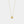 Gold necklace with a small pendant on a light gray background