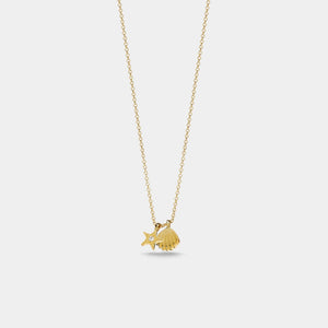 Gold necklace with a small pendant on a light gray background