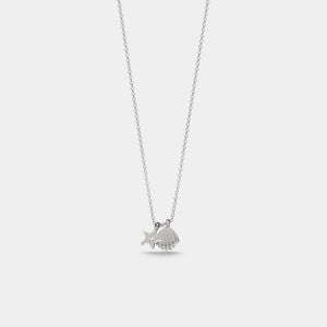 Silver necklace with a small pendant on a light gray background