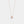 Rose gold necklace with a heart-shaped pendant on a light gray background