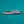 Two silver rings with diamond accents on a teal background