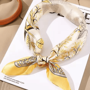 Yellow and white patterned scarf on a magazine