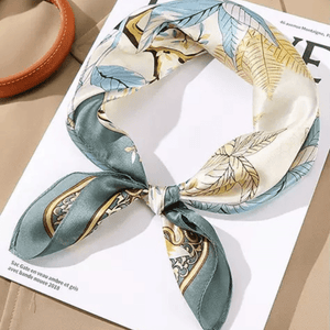 Decorative scarf with leaf pattern on a magazine page