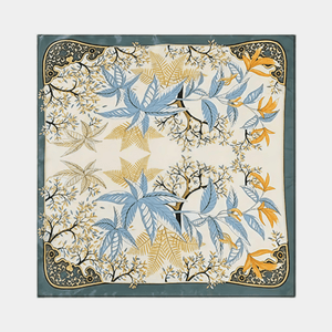 Decorative scarf with floral and leaf pattern on a white background