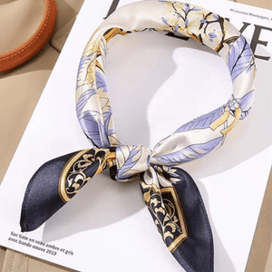 Decorative scarf with floral and geometric pattern on a magazine page