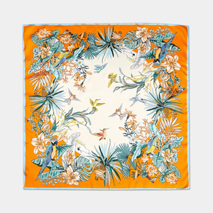 Floral and bird patterned scarf on a white background