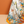 Colorful fabric with tropical patterns and birds on a brown background