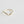 Gold ring with a small diamond on a light gray background
