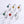 Set of silver rings with colorful gemstones on a white background