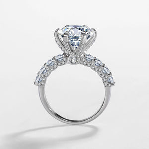 Diamond ring with a clear gemstone on a light gray background