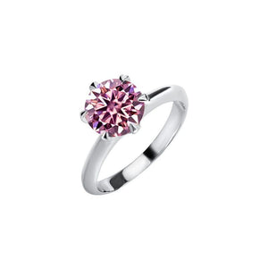 A solitaire color moissanite engagement ring with a hypoallergenic finish, set in a sterling silver band.