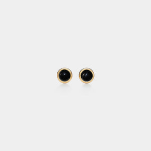 Pair of black stud earrings on a white background