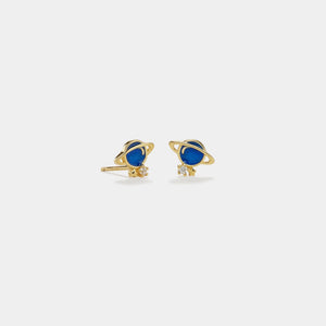 Gold planet-shaped earrings with blue centers on a white background
