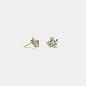 Gold sea turtle-shaped earrings with blue enamel on a white background