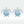 Sea turtle-shaped earrings with blue enamel design on a light gray background