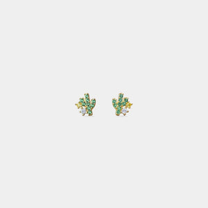 Pair of earrings with green gemstones on a white background
