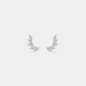 Pair of diamond earrings on a light gray background
