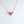 Three small heart-shaped pendant necklaces on gold-plated chains, displayed against a white background.
