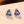 Multicolored triangular gemstone earrings on a light background