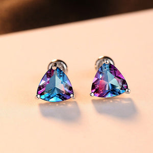 Multicolored triangular gemstone earrings on a light background