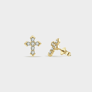 Gold cross earrings with clear gemstones on a light gray background