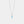 Silver necklace with a round blue gemstone on a light gray background