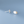 Silver cloud-shaped earrings with a gold star on a light blue background