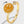 Gold ring with a smiley face design on a light gray background