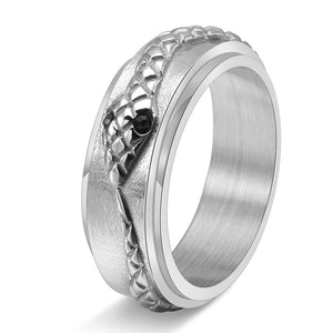 Three rings with snake designs on them, displayed on a dark background. The rings come in different metallic finishes: black, gold, and silver.