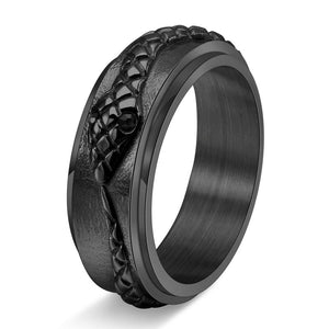 Three rings with snake designs on them, displayed on a dark background. The rings come in different metallic finishes: black, gold, and silver.