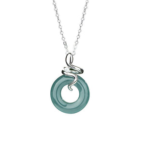 Teal pendant with silver chain on a white background