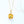 Gold necklace with a yellow gemstone pendant on a white background