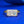 Gold ring with a large diamond on a blue background