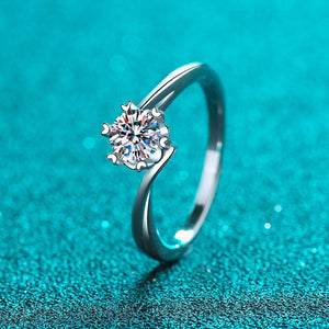 Silver ring with a diamond on a turquoise background