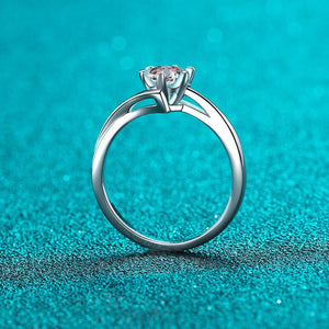 Silver ring with a diamond on a turquoise background