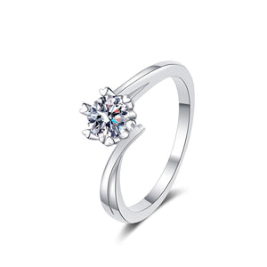 Silver ring with a diamond on a white background