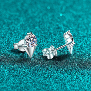 Silver stud earrings with a clear gemstone on a teal glittery background