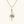 Gold pendant with a diamond on a white background