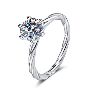 Silver ring with a diamond on a white background