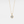 Gold necklace with a diamond pendant on a light gray background